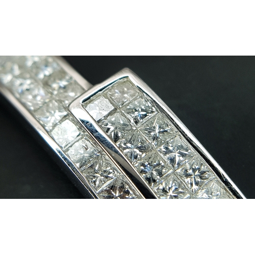 32 - A Sophisticated 18K White Gold and Diamond Crossover Bangle Bracelet. Eighty-Four Princess cut chann... 
