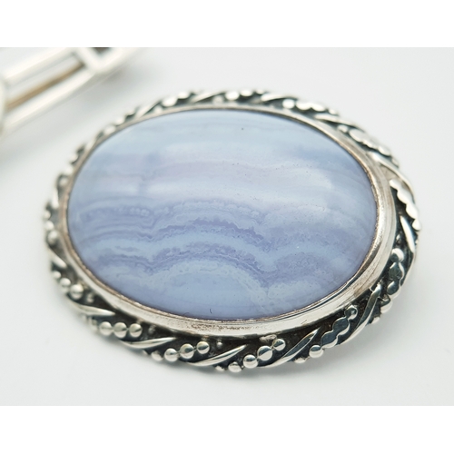 1207 - A Sterling Silver Pale Blue Oval Agate Brooch set in Silver PLUS a Sterling Silver Kit Heath Scottis... 
