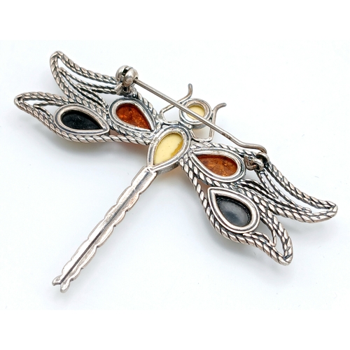 1221 - A large vintage 925 silver dragonfly brooch with amber stones. Features multi-colored amber insets o... 