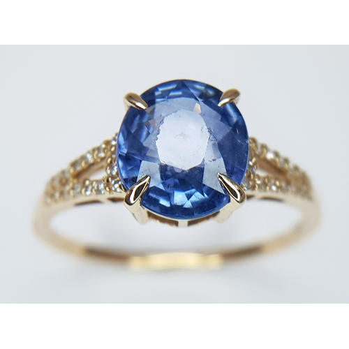 562 - A 14K YELLOW GOLD, 2.75ctw Oval Mixed Cut Natural Sapphire Ring with Diamond Accents. A 2.64ct oval ... 