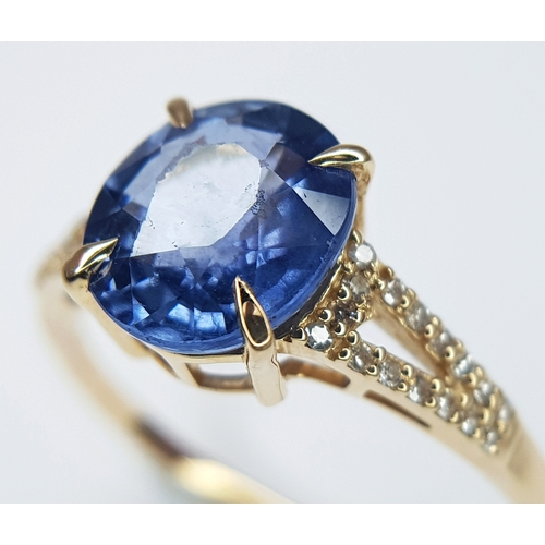 562 - A 14K YELLOW GOLD, 2.75ctw Oval Mixed Cut Natural Sapphire Ring with Diamond Accents. A 2.64ct oval ... 