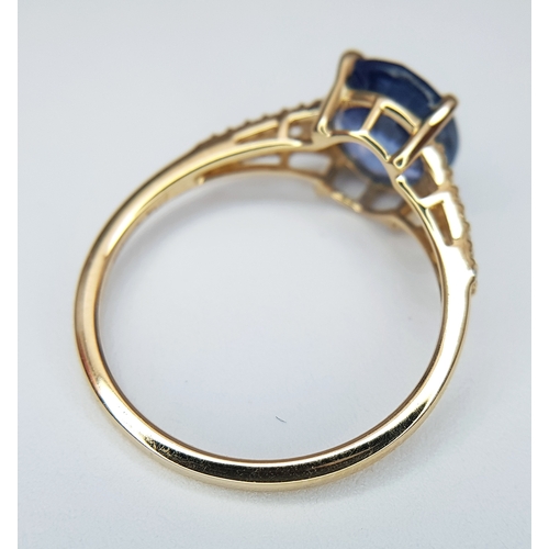 562 - A 14K YELLOW GOLD, 2.75ctw Oval Mixed Cut Natural Sapphire Ring with Diamond Accents. A 2.64ct oval ... 