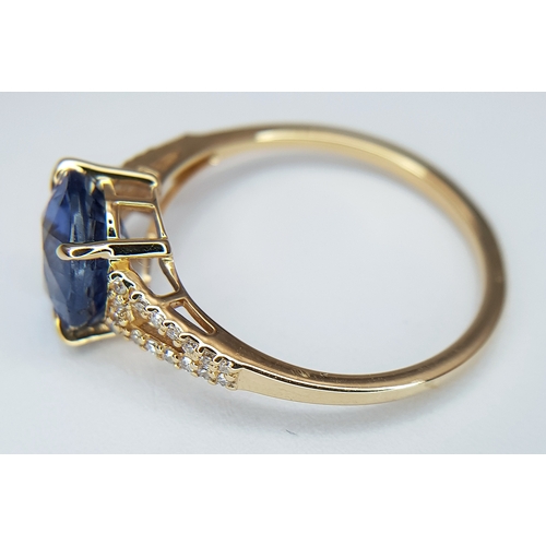 562 - A 14K YELLOW GOLD, 2.75ctw Oval Mixed Cut Natural Sapphire Ring with Diamond Accents. A 2.64ct oval ... 