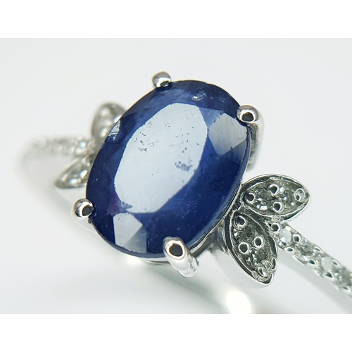 569 - A 950 PLATINUM, 1.69ctw Oval Mixed Cut Natural Sapphire Ring with Diamond Accents. Size N 1/2. Sapph... 