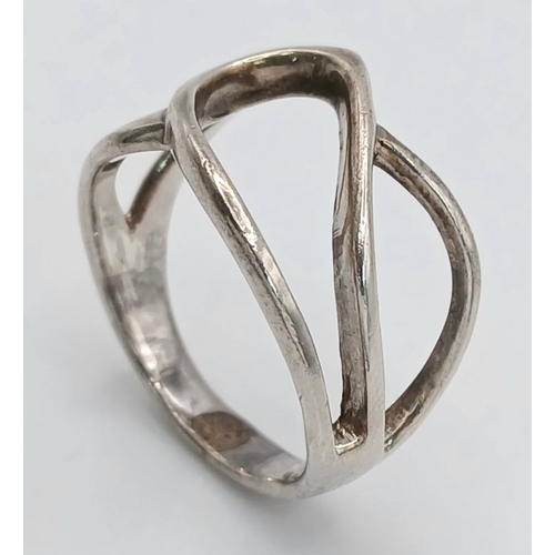 1223 - A 925 Silver Modernist Openwork Ring. Size P, 4.43g weight.