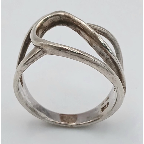 1223 - A 925 Silver Modernist Openwork Ring. Size P, 4.43g weight.
