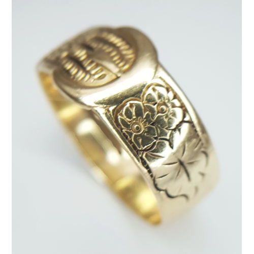 18 - A 9K Yellow Gold Band Ring in Belt Form. 8/9mm width. Size W - W1/2. 5.75g.