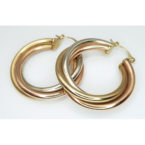 53 - A Pair of 9K Tri-Coloured Crossover Gold Hoop Earrings. 6.95g total weight. 3.5cm.