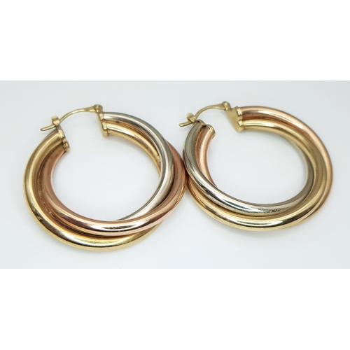 53 - A Pair of 9K Tri-Coloured Crossover Gold Hoop Earrings. 6.95g total weight. 3.5cm.