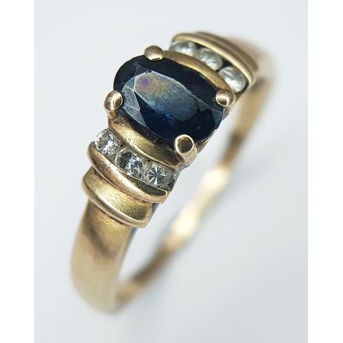 60 - A 9K Yellow Gold Diamond and Sapphire Ring. Size K 1/2. 2.2g.