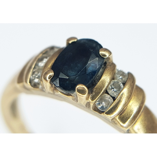 60 - A 9K Yellow Gold Diamond and Sapphire Ring. Size K 1/2. 2.2g.