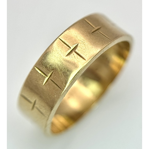 25 - A 9K Yellow Gold Band Ring with Geometric Pattern. 5mm width. Size L 1/2. 2.75g.