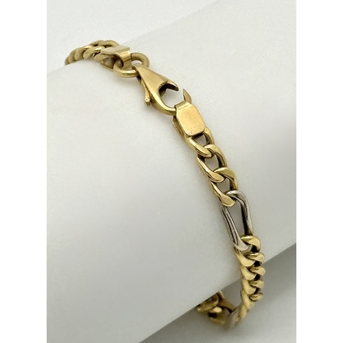 36 - An 18K Yellow and White Gold Fancy Figaro Link Bracelet. 18cm. 5.25g, clasp as found, see photo.