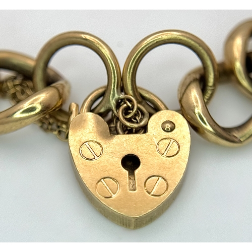 15 - A Vintage 9K Yellow Gold Curb Link Bracelet with Heart Clasp and safety chain. 18cm. 16.57cm.