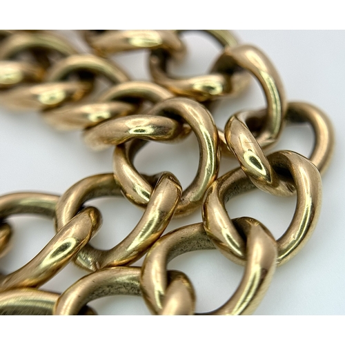 15 - A Vintage 9K Yellow Gold Curb Link Bracelet with Heart Clasp and safety chain. 18cm. 16.57cm.