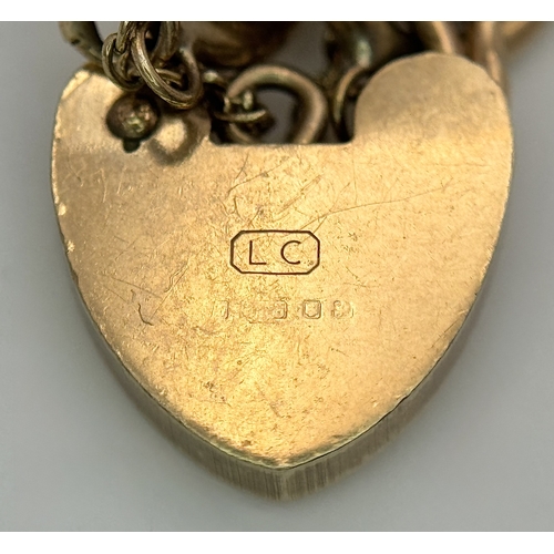 15 - A Vintage 9K Yellow Gold Curb Link Bracelet with Heart Clasp and safety chain. 18cm. 16.57cm.