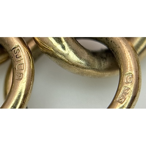 15 - A Vintage 9K Yellow Gold Curb Link Bracelet with Heart Clasp and safety chain. 18cm. 16.57cm.