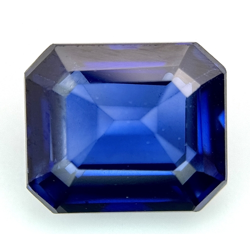A 7.80ct Natural Sapphire Gemstone, Octagon Step Cut. Measurements: 12.01mm x 10.09mm x 5.91mm. Lightly included. Comes with a W.G.I Certificate.