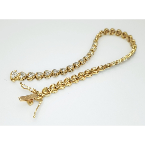 11 - An 18K Yellow Gold Diamond Tennis Bracelet in Heart-Shaped Links. Over 100 round brilliant cut diamo... 