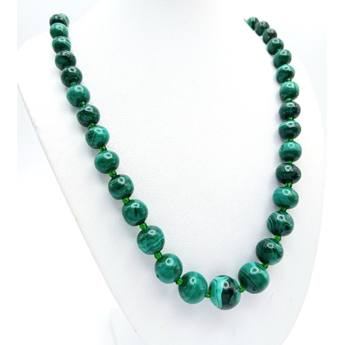 1227 - A Pretty Malachite Bead Necklace. Approx 54cm length.