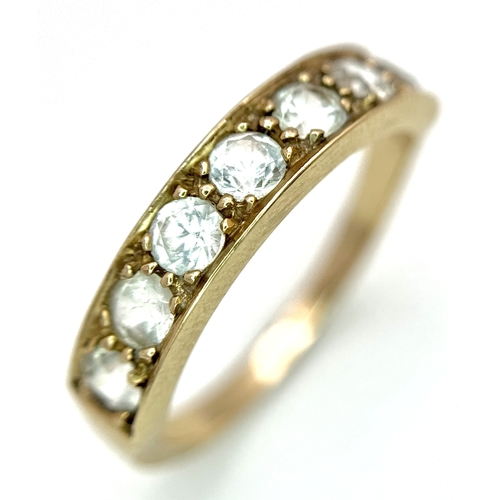 46 - A 14K Yellow Gold (tests as) White Stone Half Eternity Ring. Size L 1/2. 2.7g total weight.