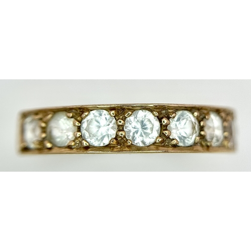 46 - A 14K Yellow Gold (tests as) White Stone Half Eternity Ring. Size L 1/2. 2.7g total weight.