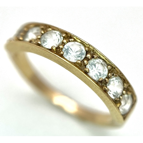 46 - A 14K Yellow Gold (tests as) White Stone Half Eternity Ring. Size L 1/2. 2.7g total weight.