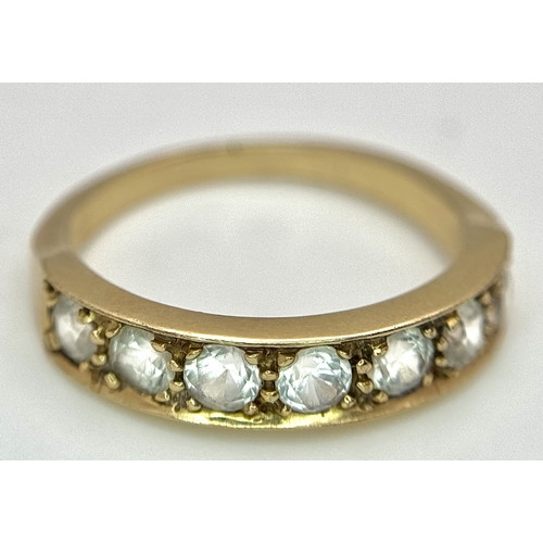 46 - A 14K Yellow Gold (tests as) White Stone Half Eternity Ring. Size L 1/2. 2.7g total weight.