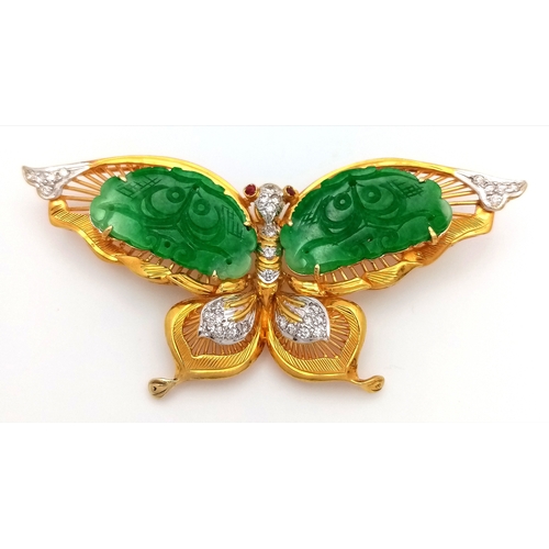 The Butterfly Queen! An 18K Yellow Gold, jade, diamond and ruby butterfly that can be worn as a brooch or pendant. Hand carved jade wings, diamond body and wing tips with ruby eyes! 7cm wingspan. 17.8g total weight. MT08.