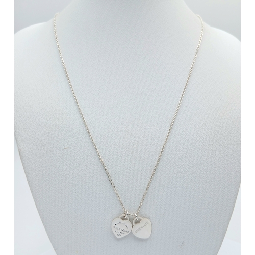561 - A Tiffany & Co. 925 Silver Double Tag Pendant Necklace and An Additional Pendant/Charm. Approx 48cm ... 