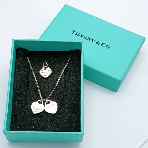 561 - A Tiffany & Co. 925 Silver Double Tag Pendant Necklace and An Additional Pendant/Charm. Approx 48cm ... 