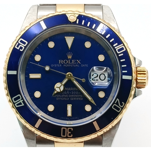 876 - A Classic Rolex Bi-Metal Submariner Automatic Gents Watch. Model 16613. Gold and stainless steel bra... 