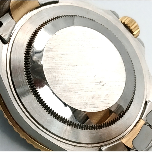 876 - A Classic Rolex Bi-Metal Submariner Automatic Gents Watch. Model 16613. Gold and stainless steel bra... 