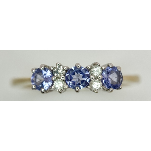 1231 - A Beautiful 9k Yellow Gold Tanzanite and Diamond Set Ring Size N. The Ring is set with three 3mm Rou... 