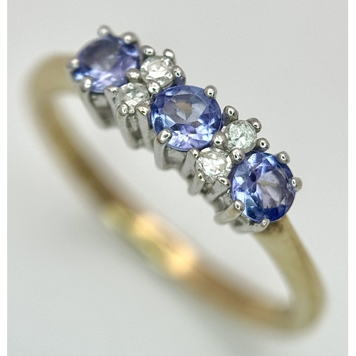 1231 - A Beautiful 9k Yellow Gold Tanzanite and Diamond Set Ring Size N. The Ring is set with three 3mm Rou... 
