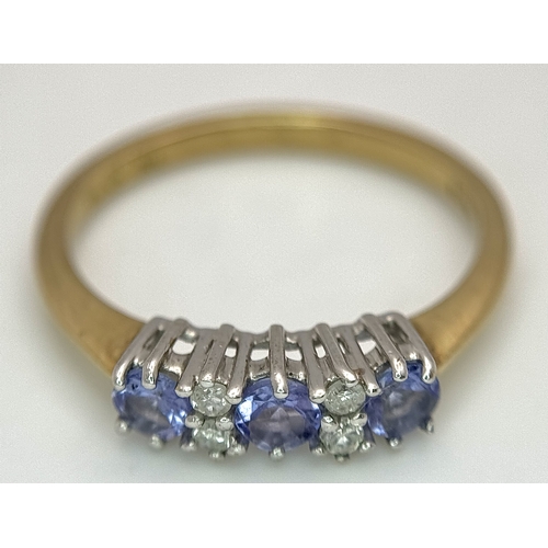 1231 - A Beautiful 9k Yellow Gold Tanzanite and Diamond Set Ring Size N. The Ring is set with three 3mm Rou... 
