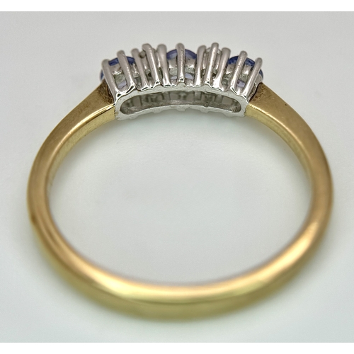 1231 - A Beautiful 9k Yellow Gold Tanzanite and Diamond Set Ring Size N. The Ring is set with three 3mm Rou... 