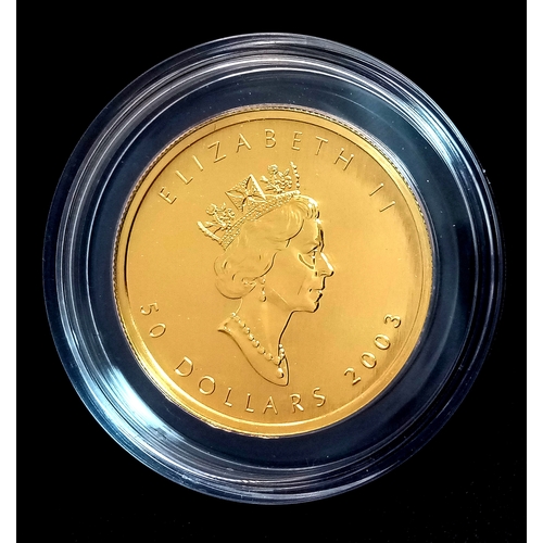 A 24K GOLD 1oz MAPLE LEAF 50 DOLLAR COIN DATED 2003 AND COMING IN A CAPSULE AND ORIGINAL BOX.