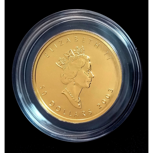 A 24K GOLD CANADIAN 50 DOLLAR COIN WEIGHING 1oz AND DATED 2003 COMING IN CAPSULE AND ORIGINAL BOX .