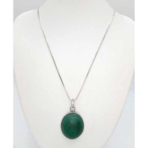 1212 - A 925 Silver Necklace with an Oval Malachite Pendant. Both necklace and pendant are hallmarked 925. ... 
