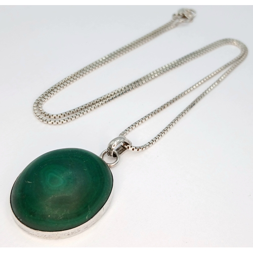 1212 - A 925 Silver Necklace with an Oval Malachite Pendant. Both necklace and pendant are hallmarked 925. ... 