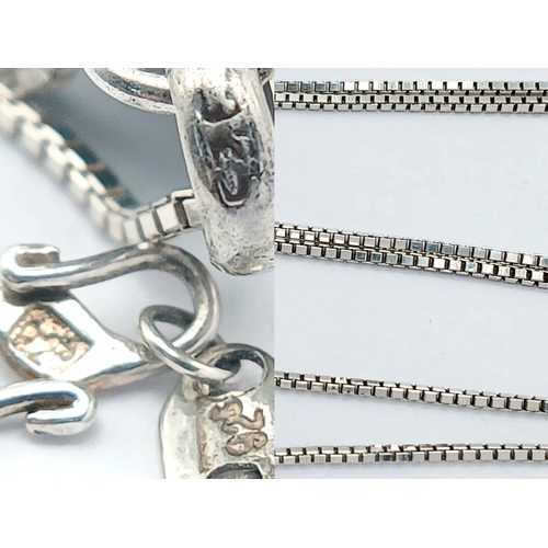 1212 - A 925 Silver Necklace with an Oval Malachite Pendant. Both necklace and pendant are hallmarked 925. ... 