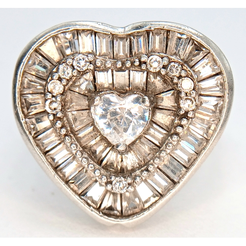 1241 - A 925 Silver Heart Shaped Clear Stone Cluster Ring. Heart shaped centre with clear stone set halo an... 
