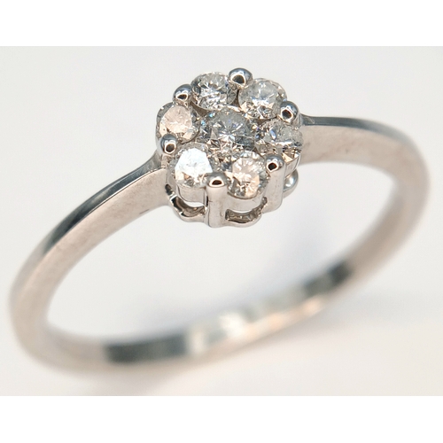 573 - A 9K WHITE GOLD, DIAMOND SET CLUSTER RING. 0.25CTW. 1.8G, SIZE Q. SC 2039
