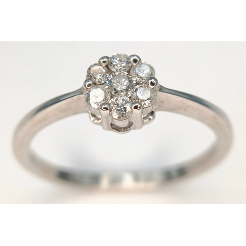 573 - A 9K WHITE GOLD, DIAMOND SET CLUSTER RING. 0.25CTW. 1.8G, SIZE Q. SC 2039