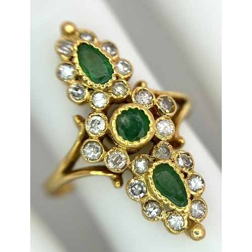 6 - AN 18K YELLOW GOLD, DIAMOND AND EMERALD SET, MARQUISE SHAPED, COCKTAIL RING. 4.7G, SIZE Q. TAN 2002