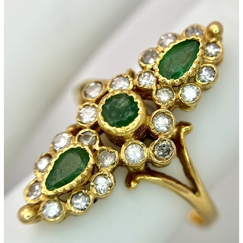 6 - AN 18K YELLOW GOLD, DIAMOND AND EMERALD SET, MARQUISE SHAPED, COCKTAIL RING. 4.7G, SIZE Q. TAN 2002