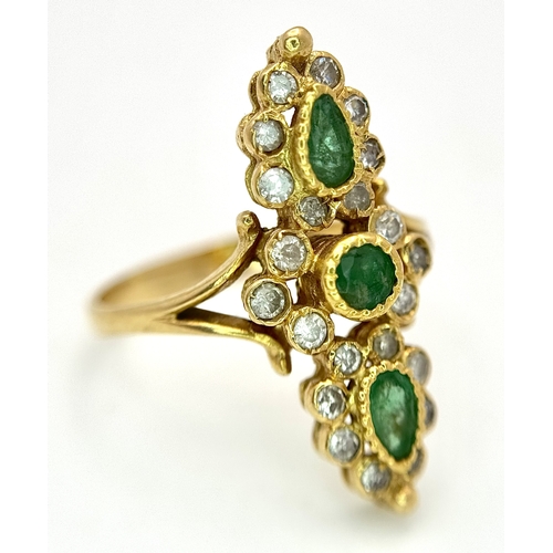 6 - AN 18K YELLOW GOLD, DIAMOND AND EMERALD SET, MARQUISE SHAPED, COCKTAIL RING. 4.7G, SIZE Q. TAN 2002