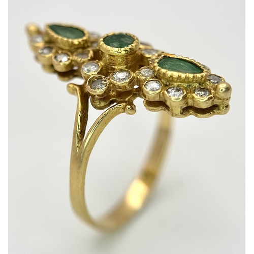 6 - AN 18K YELLOW GOLD, DIAMOND AND EMERALD SET, MARQUISE SHAPED, COCKTAIL RING. 4.7G, SIZE Q. TAN 2002