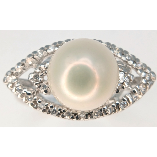 1255 - A 925 Silver Pearl and Clear Stone Set Ring. Size N 1/2. Total weight: 3.65g.